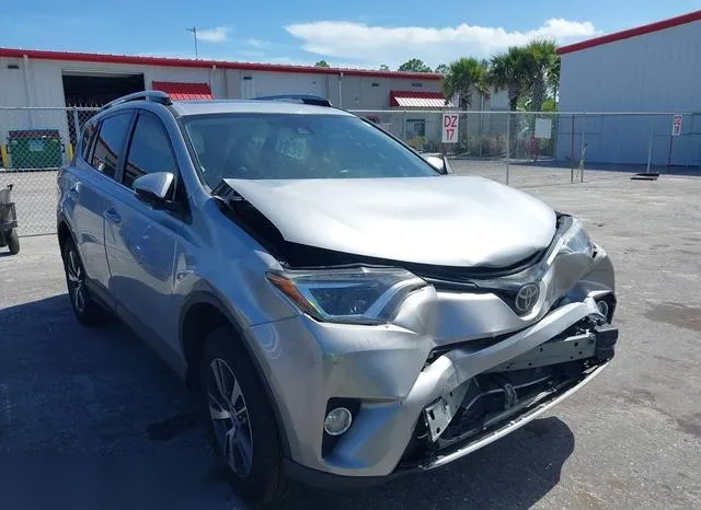 2T3WFREV2JW481612 2018 2018 Toyota RAV4- Xle 1