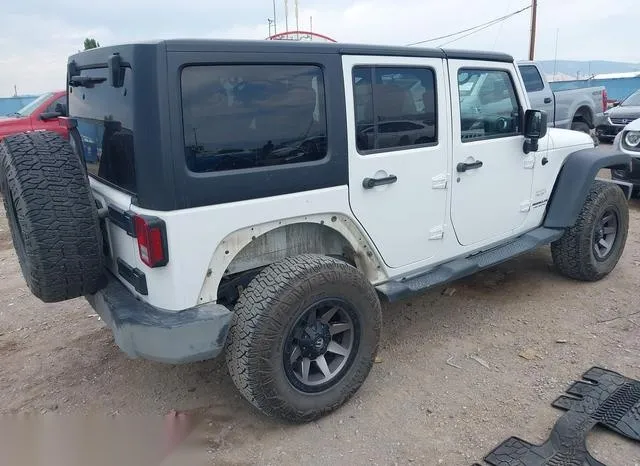 1C4BJWEG6EL243946 2014 2014 Jeep Wrangler- Unlimited Sahara 4