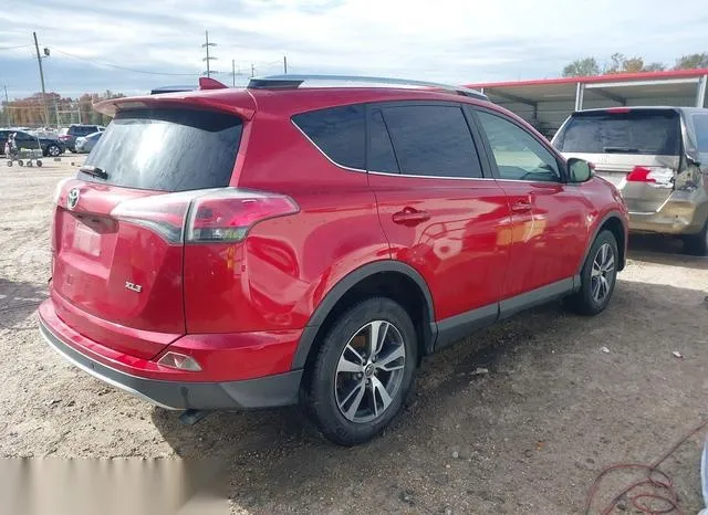 JTMWFREV9GJ071669 2016 2016 Toyota RAV4- Xle 4