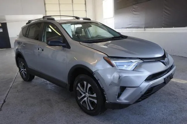 2T3BFREV2JW703063 2018 2018 Toyota RAV4- LE 1